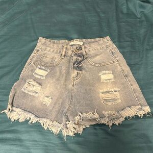 Light wash Jean shorts. Distressed and high waisted.